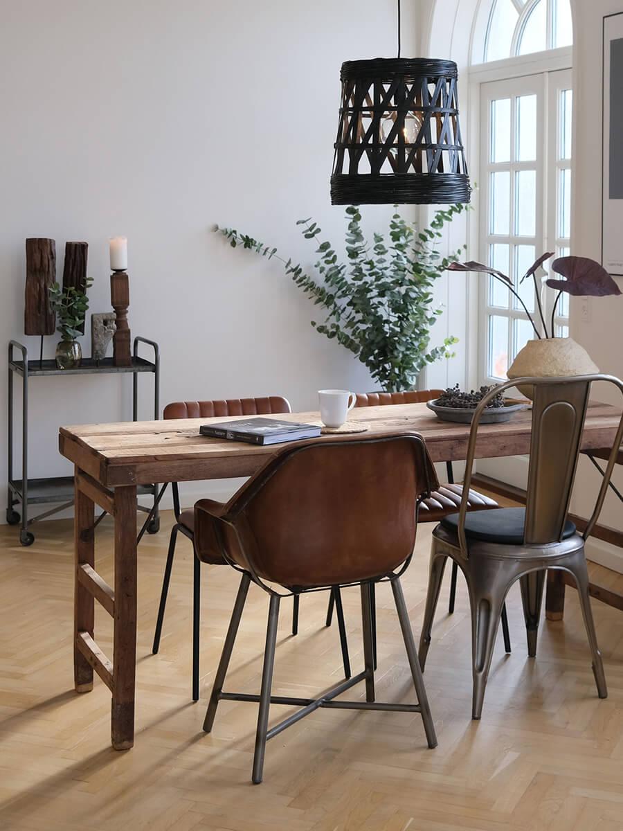Recycled furniture. A dining table made from reclaimed wood.